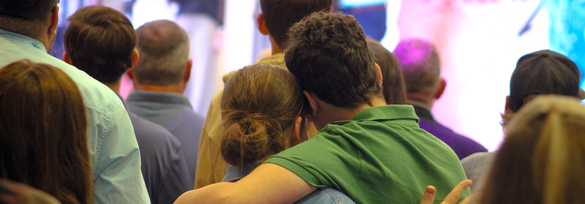 People hugging during worship